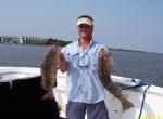 Captain John Of Hookedup Charters with two hand fulls of .....