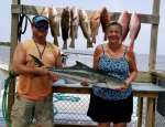 SUSAN SHOWING OFF HER NICE COBIA W CAPT JOHN