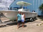 The Killhams with their new used boat purchase from Cedar Key Marina II, happy couple