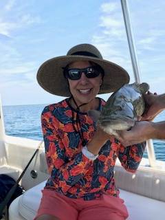 Mrs Scott with a grumpy grouper, released unharmed