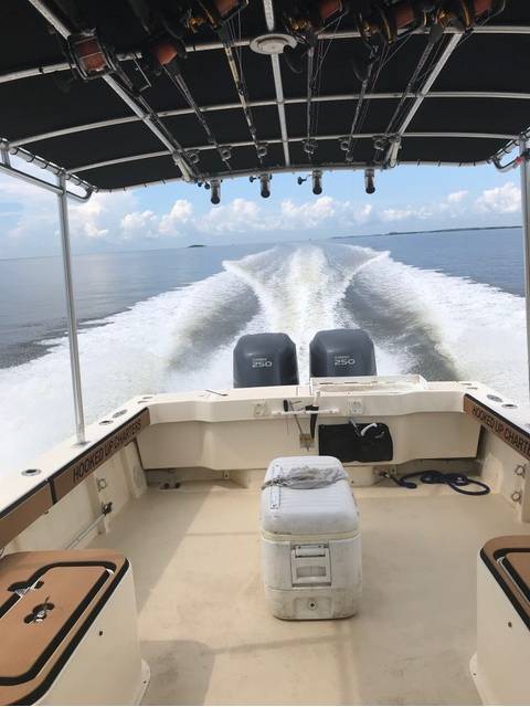 Captain John on the way back in with the kids from grouper fishing