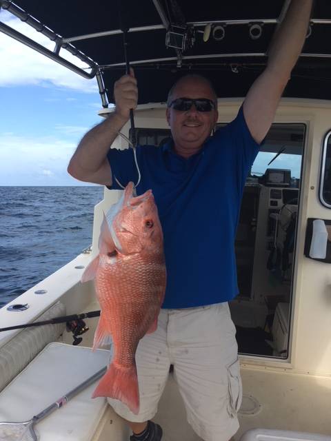 Cyrstal's crew mate w a monster snapper, caught w Captain John
