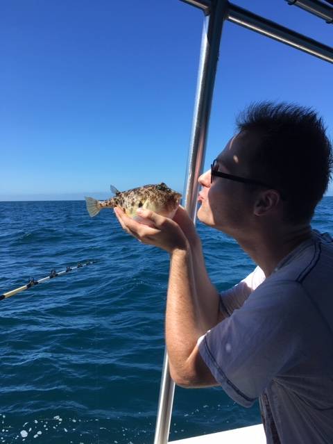 Joseph puckering up with his blow fish