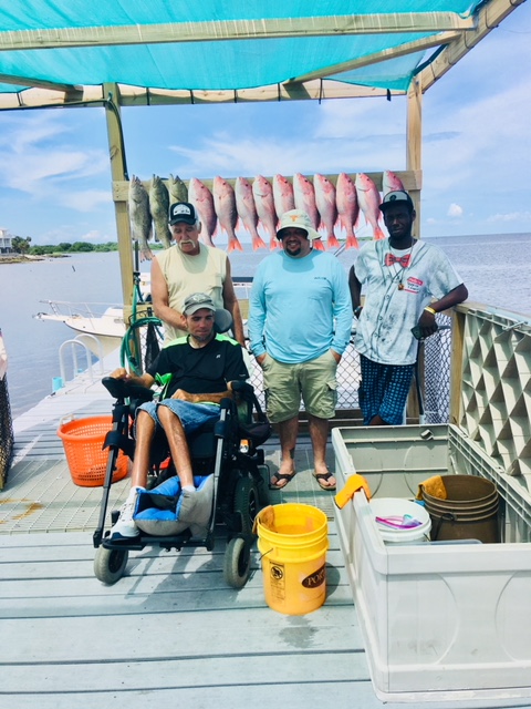 Justin's crew with a good catch on a rainy day w Capt John