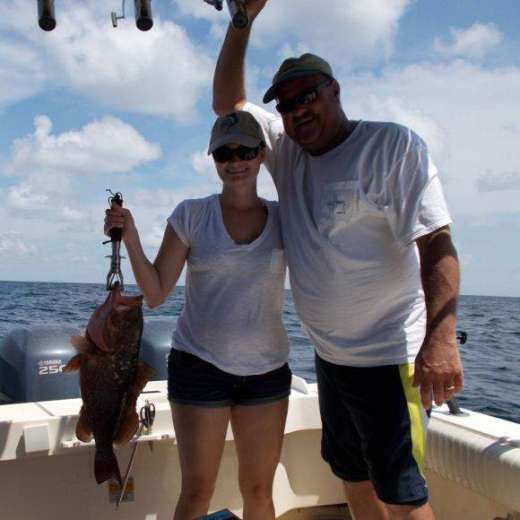 Ron and daughter Amanda with a nice grouper caught with Capt. John of Hooked Up Charters