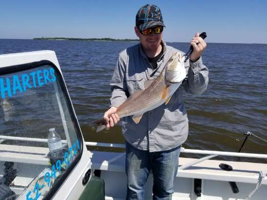 Chad with a nice Redfish caught with Captain Kyle
