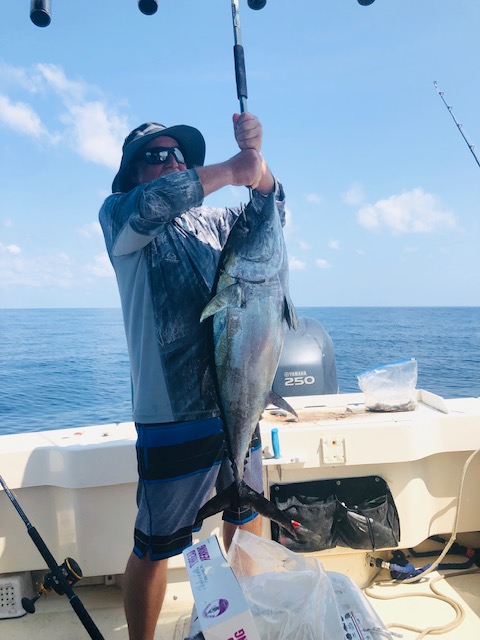Terry's crew member with his 1st Black Finned Tuna